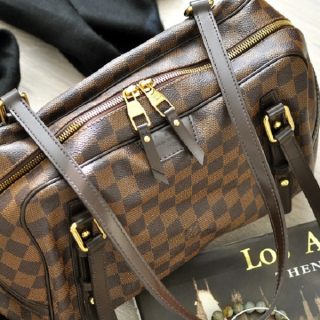 Louis Vuitton Rivington Close Up of the Handbag on a Side Table