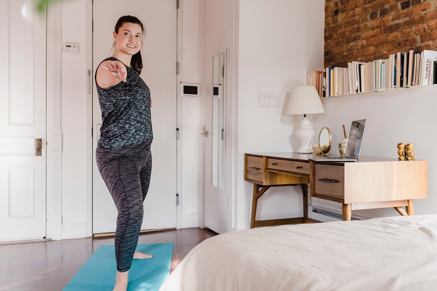 Home Workout a Woman Doing Yoga in Her Family Room