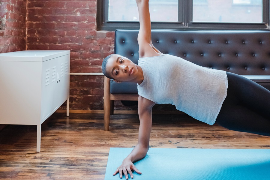 Jillian Michaels Body Revolution a Woman Doing a Side Plank