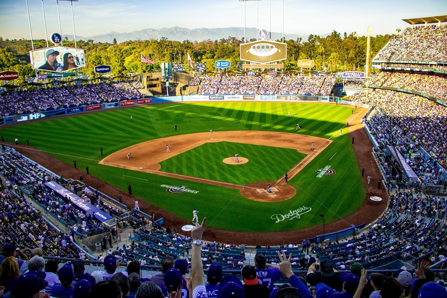Things To Do in Los Angeles for Families View of Dodgers Stadium with an audience in the Stands and Players on the Field