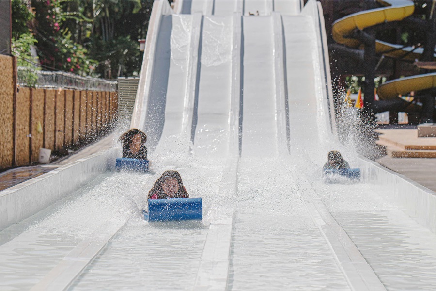 Things To Do in Los Angeles for Families Three Kids Going Down a Water Slide