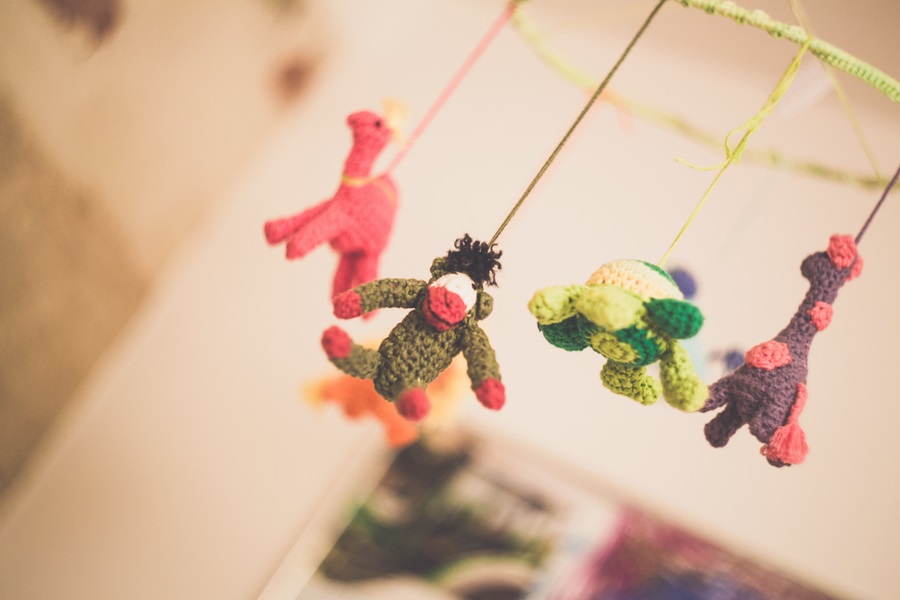 5 Things NOT to Say when Someone Loses a Baby a Mobile with Small Stuffed Animals Hanging From It