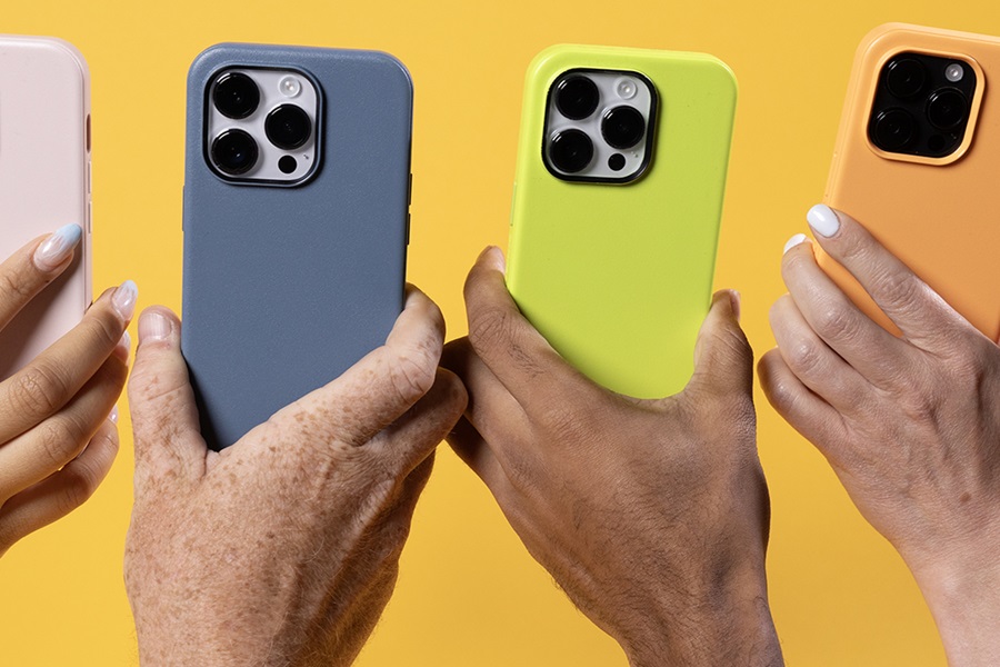 Otterbox Symmetry vs Commuter Cases How Do They Compare Close Up of Multiple People's Hands Holding Up a Phone Each in a Different Colored Otterbox Case