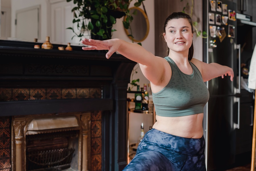 Jillian Michaels BODYSHRED Rise Workout Tips a Woman Doing Yoga