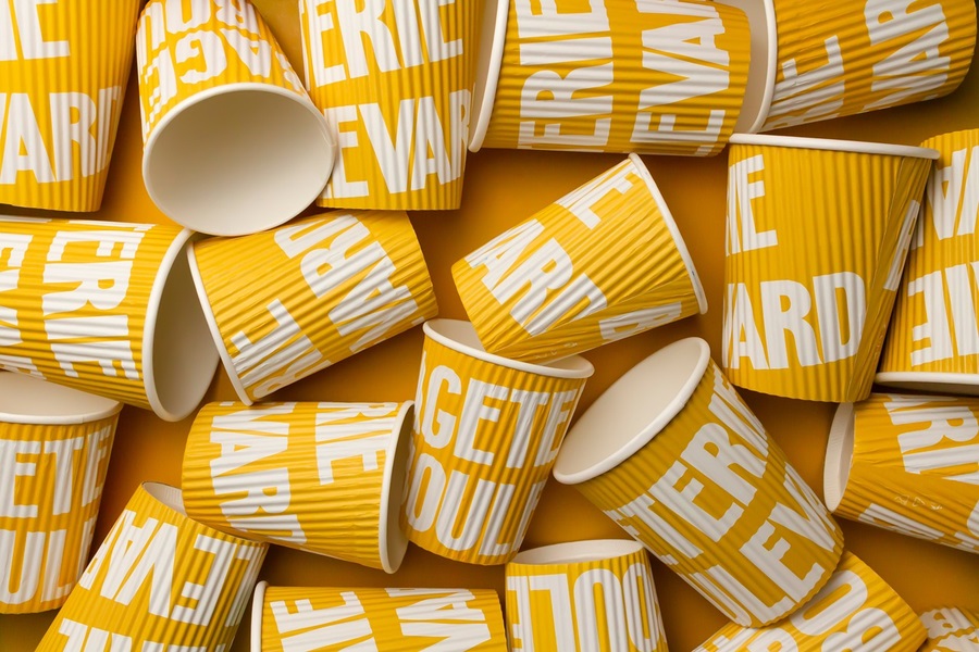 April Fools Ideas For Your Wife Close Up of a Pile of Yellow Paper Cups
