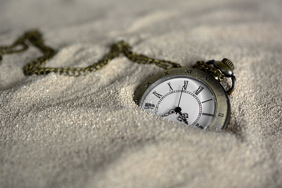 April Fool's Day Close Up of a Pocket Watch in Sand