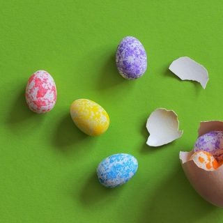Easter Treats Green Surface with Broken Easter Eggs on it