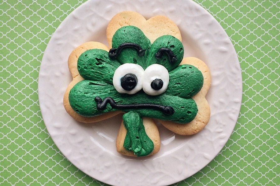 Green Drinks For Kids and Adults a Four Leaf Clover Cookie with Green Icing and Chocolate Eyes