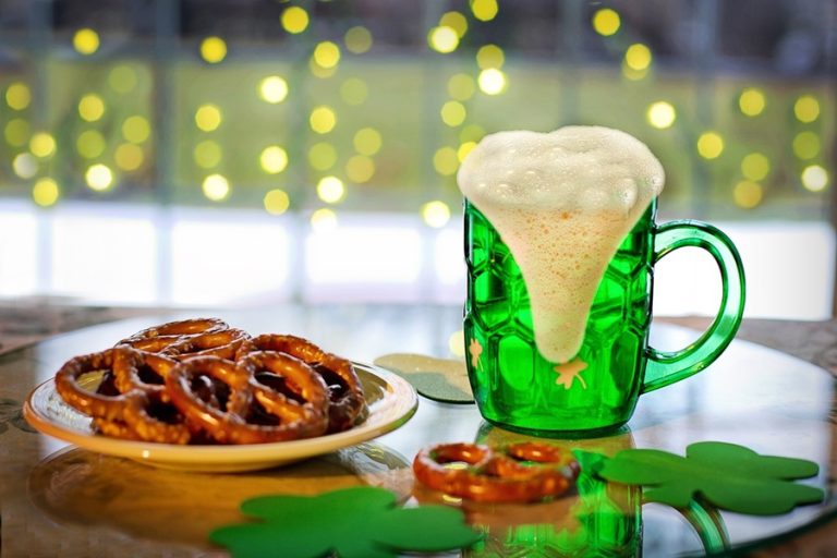 Green Drinks For Kids and Adults a Green Beer Next to a Small Plate of Pretzels