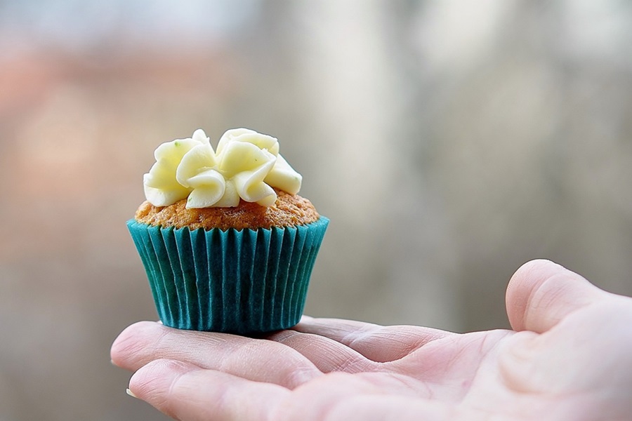 April Fools Ideas For Your Wife Close Up of a Small Cupcake in a Persons Hand 
