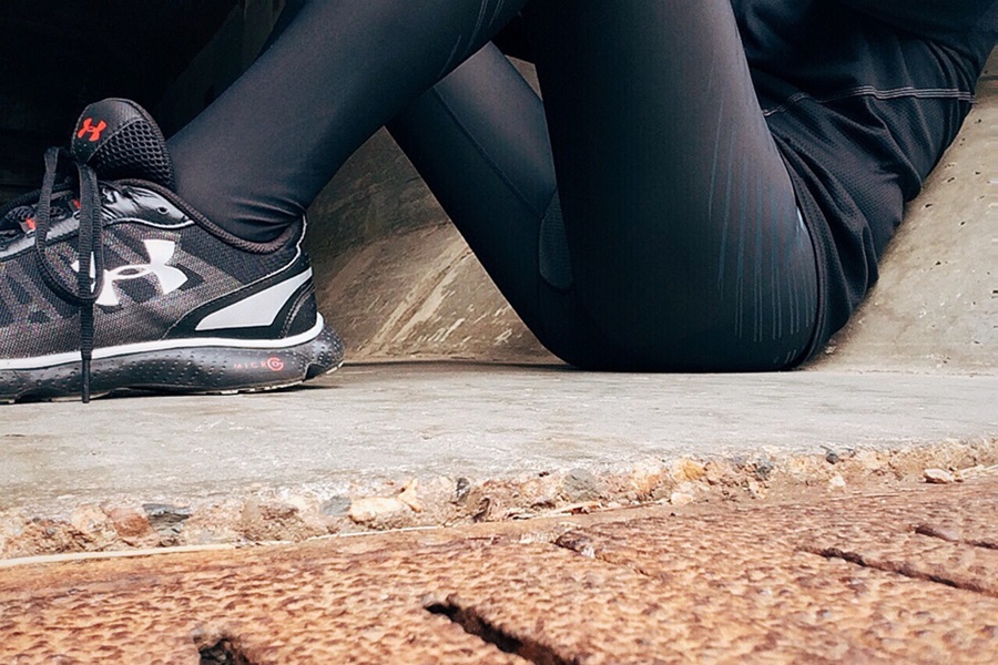How Long are Cize Workouts Close Up of a Person Wearing Workout Clothes Sitting on the Ground Taking a Break