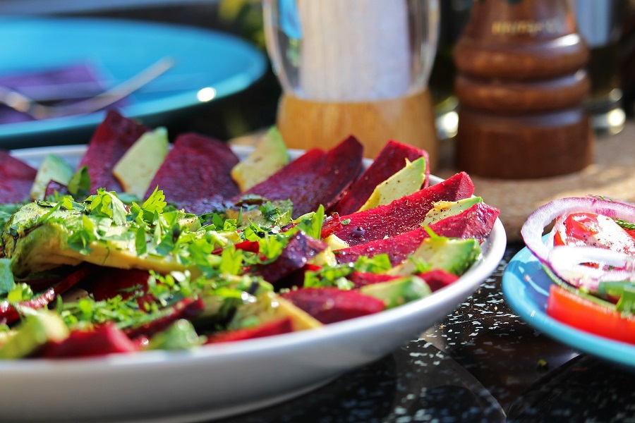 Dairy Free Lunch Ideas a Beet Salad on a Plate with Seasonings in the Background