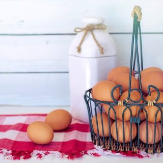 Jillian Michaels Breakfast Ideas Close Up of a Basket of Eggs Next to a Jug of Milk