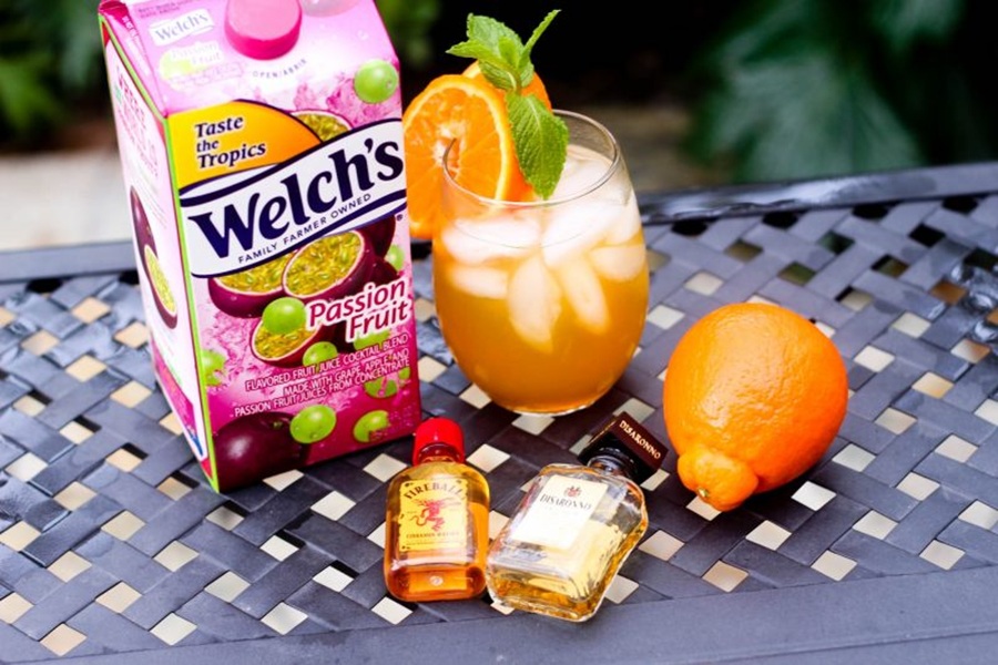 Easy Fireball Cocktail Recipe Ingredients Sitting on a Black Table Outside