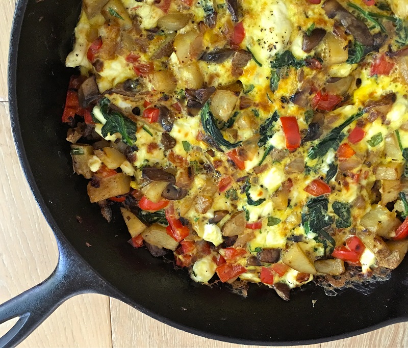 Enjoy this Jillian Michaels spinach frittata recipe with potatoes peppers and feta anytime of day to stay on your meal plan or to simply eat healthy.