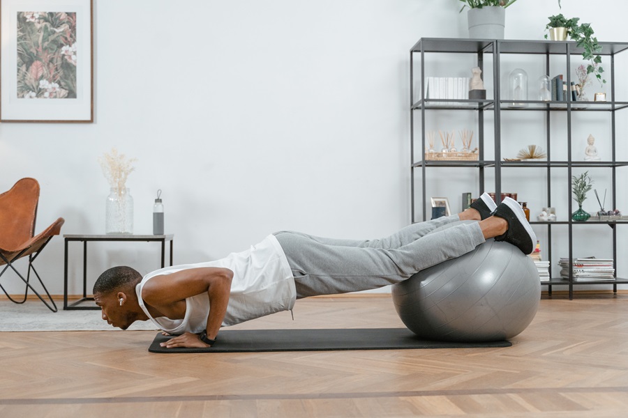 Jillian Michaels 30 Day Shred Workout Tips a Man Doing Pushups Using a Yoga Ball Indoors