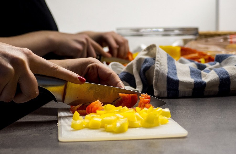 Jillian Michaels Dinner Recipes Close Up of A Person Cutting Veggies