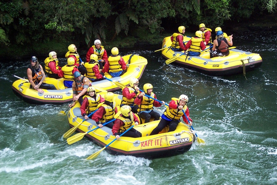 Whitewater Rafting Terms and Lingo To Know Three Yellow Rafts Each Filled with People on a River