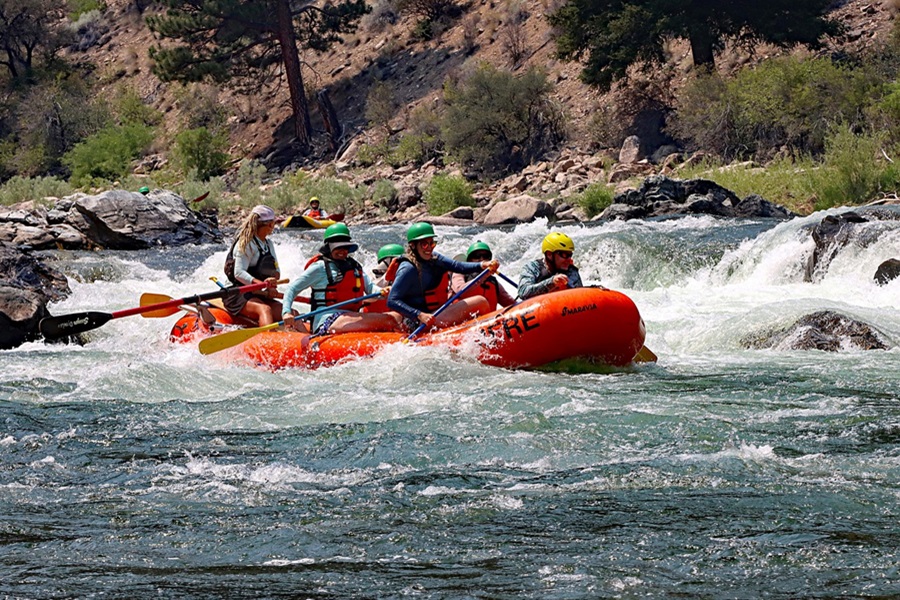 Whitewater Rafting Terms and Lingo To Know a Red Raft with People Going Down River
