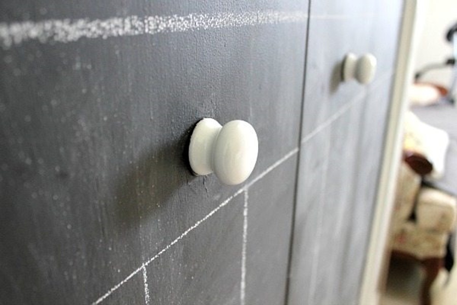 Closet Doors DIY Tutorial with Photos Close Up of Two White Knobs on a Chalkboard Closet Door