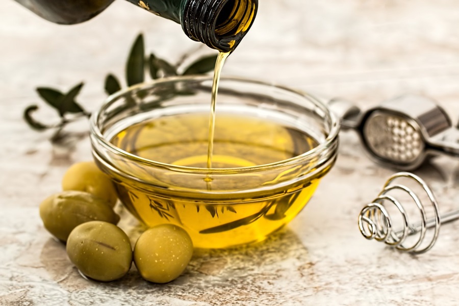 Slimming Foods To Eat Close Up of a Small Bowl of Olive Oil