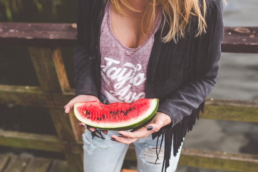 What are Standard Process Supplements a Woman Eating a Large Watermelon Wedge