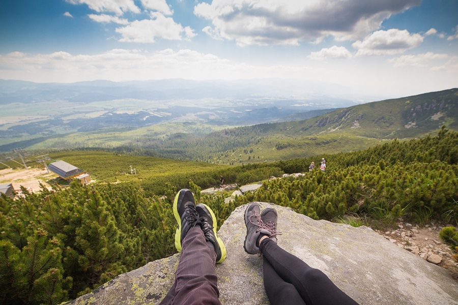 What are Standard Process Supplements Two People's Legs Sitting on a Rock with a Forest Beyond the Rock Below