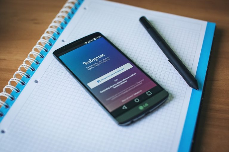 Printable Instagram Contract for Teens a Phone with Instagram Open on a Notebook Next to a Pen