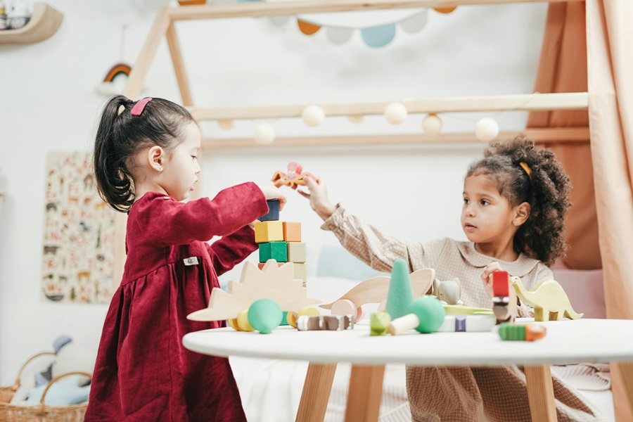 Activities for Kids Before Electronics Two Young Girls Playing with Blocks on a Table