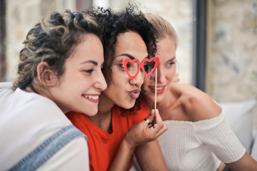 Standard Process Ovex Three Women Posing for a Pic With One Holding Heart-Shaped Glasses to Her Face