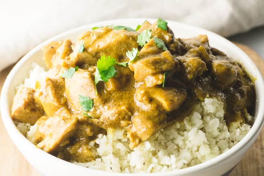 Dairy Free Ketogenic Chicken Recipes Coconut Chicken Curry in a Bowl with Cauliflower Rice
