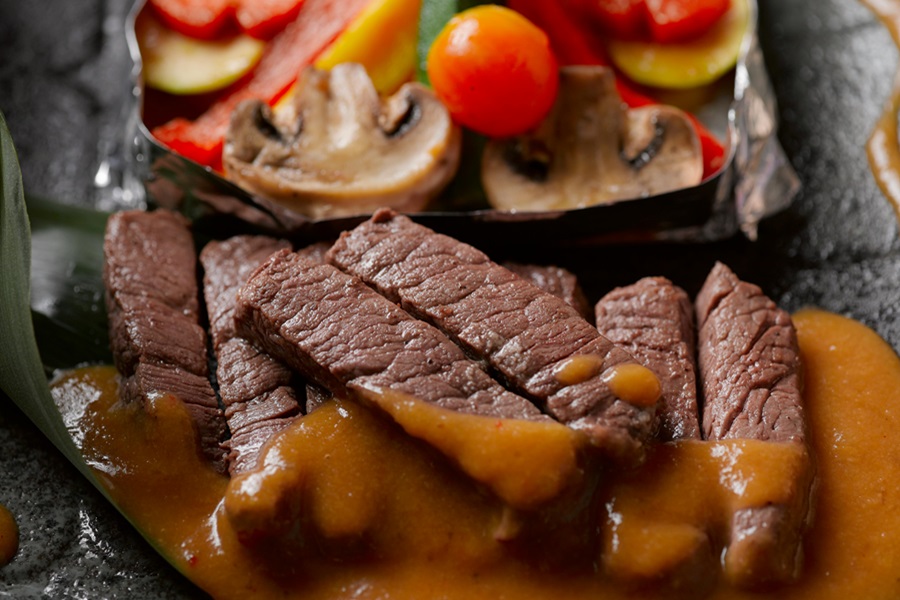 Low Carb Keto Crockpot Recipes for Lunch Close Up of a Steak Cut into Strips Covered in a Sauce