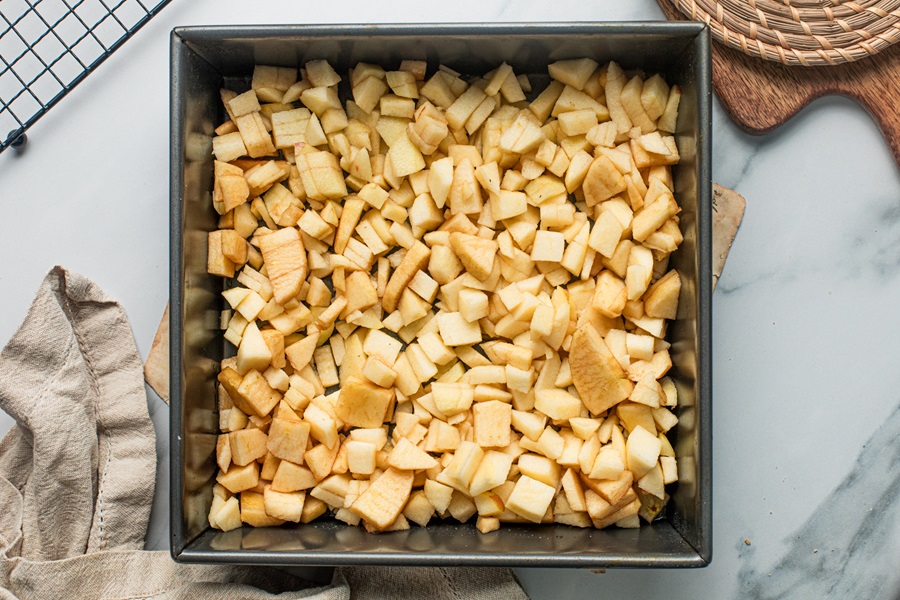 Apple Crisp with Instant Oatmeal Apples Layered in a Greased Baking Sheet