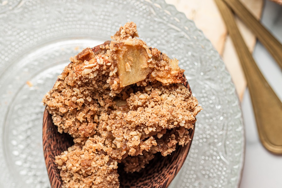 Close Up of a Wooden Spoon with Apple Crisp with Instant Oatmeal 