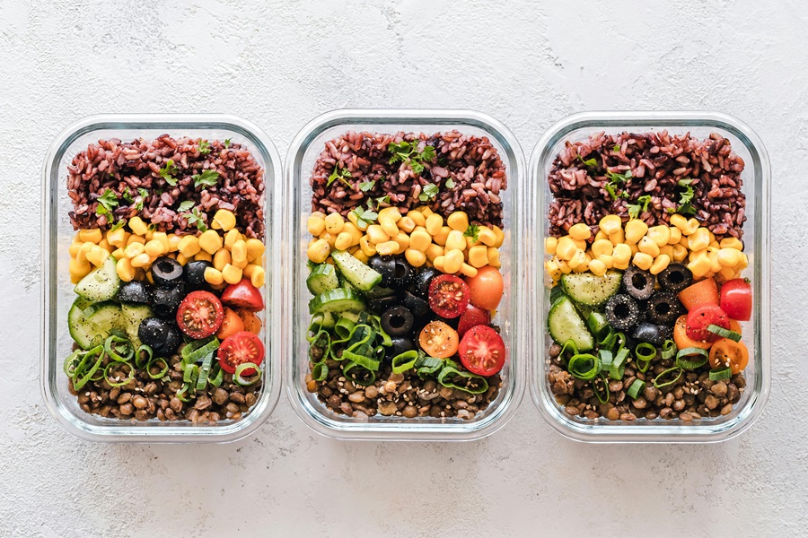 80 Day Obsession Timed Nutrition Tips View of Three Containers Filled with Burrito Bowl Ingredients