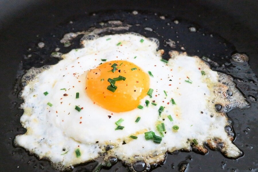 High Protein Low Carb Recipes Close Up of an Egg Being Cooked in a Pan