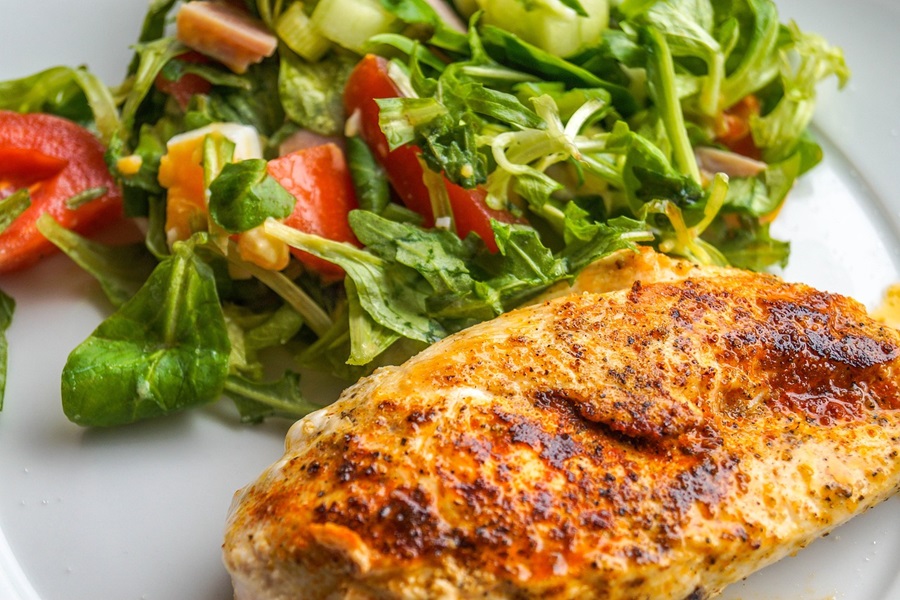 Low Carb Chicken Recipes Close Up of Baked Chicken with a Small Salad