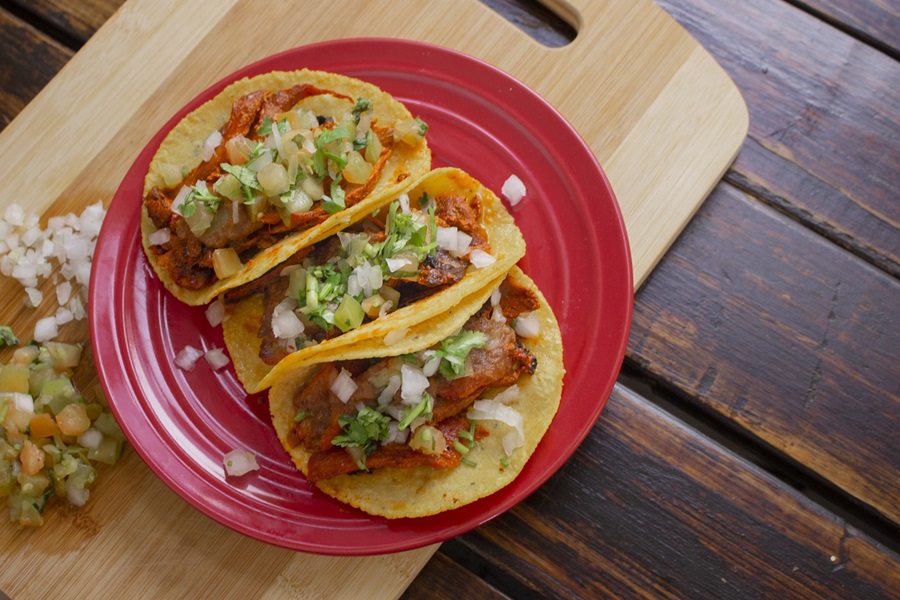 Crockpot Chicken Taco Recipes Overhead View of a Red Plate with Three Chicken Tacos on Top