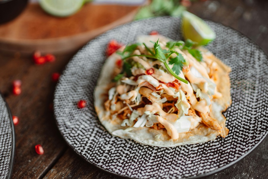 Crockpot Chicken Taco Recipes Close Up of a Classic-Style Taco Topped with Cilantro