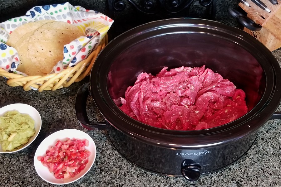 Steak Fajitas Recipe View Inside a Crockpot with Steak Inside
