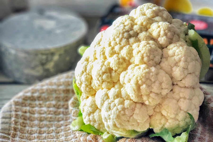 2B Mindset Buffalo Cauliflower Bites Close Up of Cauliflower on a Towel on a Counter Top 