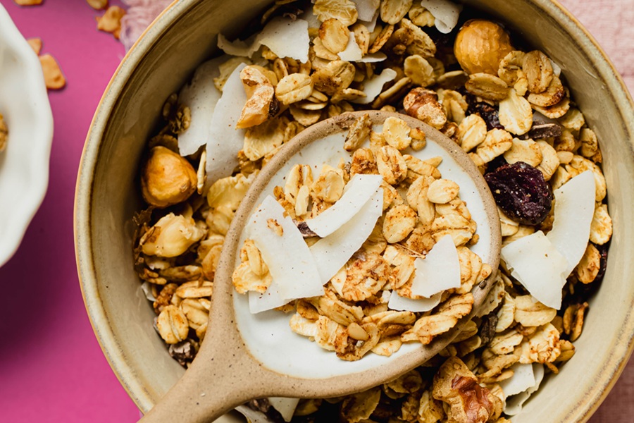 Easy Vegan Granola Recipe a Bowl of Granola with Milk and Coconut Chips