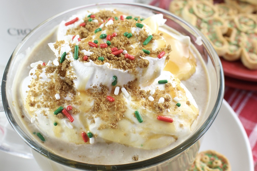 Gingerbread Latte Recipe Close Up of Whipped Cream Garnish Covered in Sprinkles and Cookie Crumbs