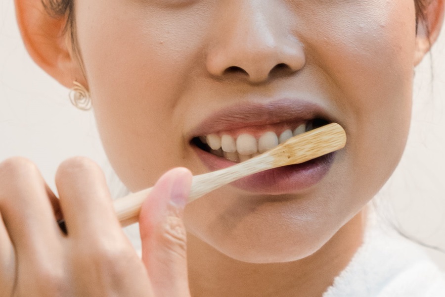 Exercises to Do While Brushing Your Teeth Close Up of a Woman Brushing Her Teeth with a Bamboo Tooth Brush