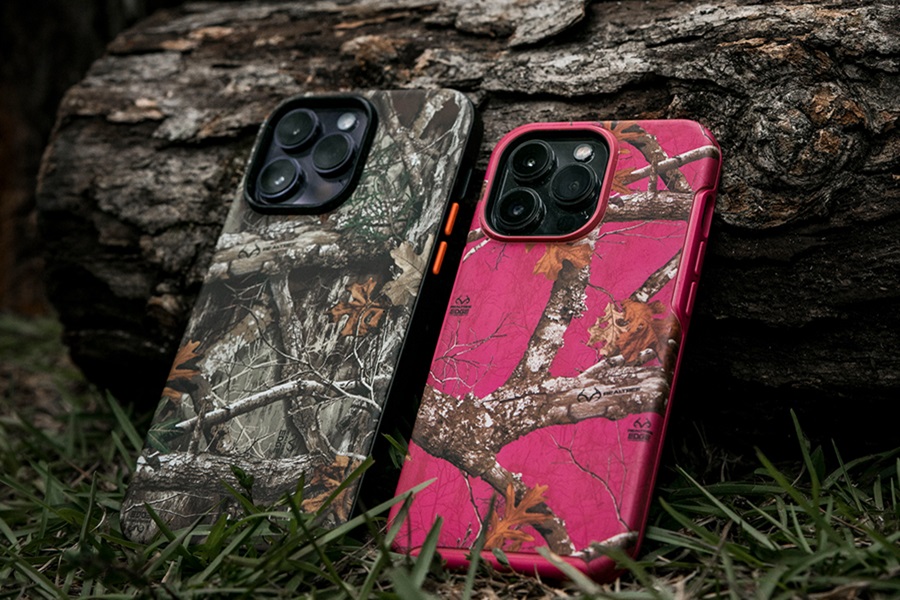 Otterbox Defender Pro vs Pursuit Close Up of Two Phones in Camo Otterbox Cases Resting Against a Log