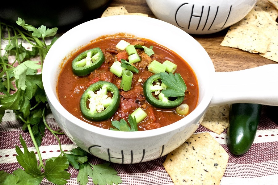 2B Mindset Recipes with Ground Beef Close Up of a Small Bowl of Chili Topped with Jalapenos
