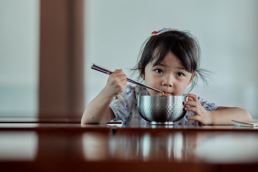 Crockpot Recipes for Kids a Little Girl Sitting at a Table Eating Food from a Metal Bowl