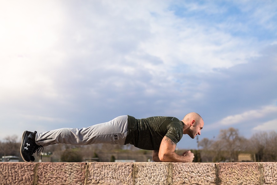 Transform 20 Week 1 Workouts and Tips a Man Doing Planks Outside 
