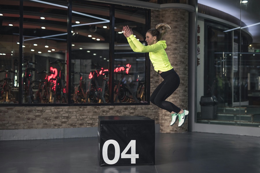 Transform 20 Week 2 Workouts and Tips a Woman Wearing Workout Clothes Jumping Onto a Crate