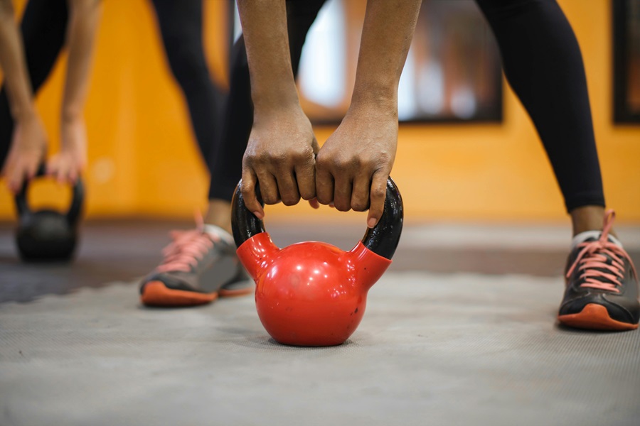 Transform 20 Week 2 Workouts and Tips Close Up of a Person Lifting a Kettlebell